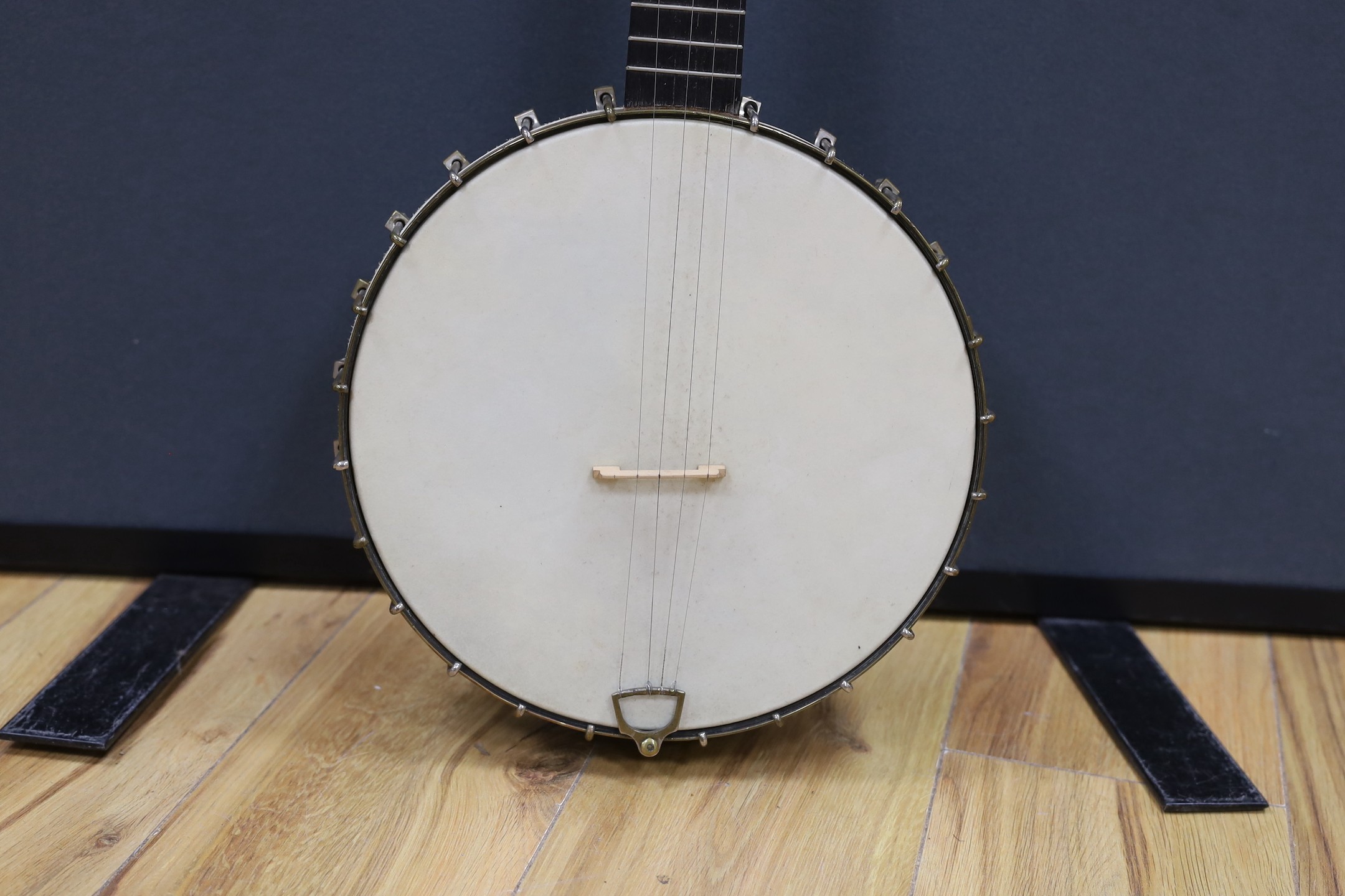A cased Reliance banjo, 88cms long